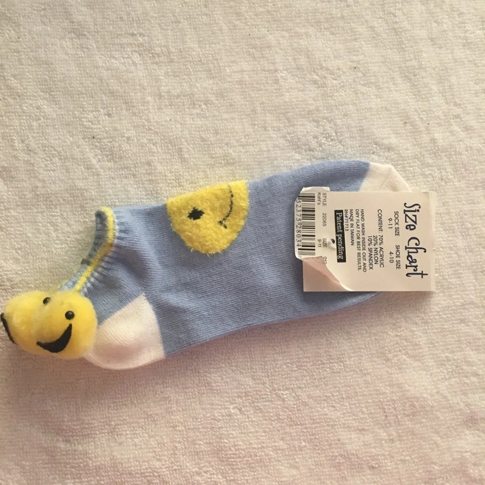 NWT smile fuzz ball socks